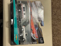 Original sealed diecast package front with Chevrolet pickup and camper