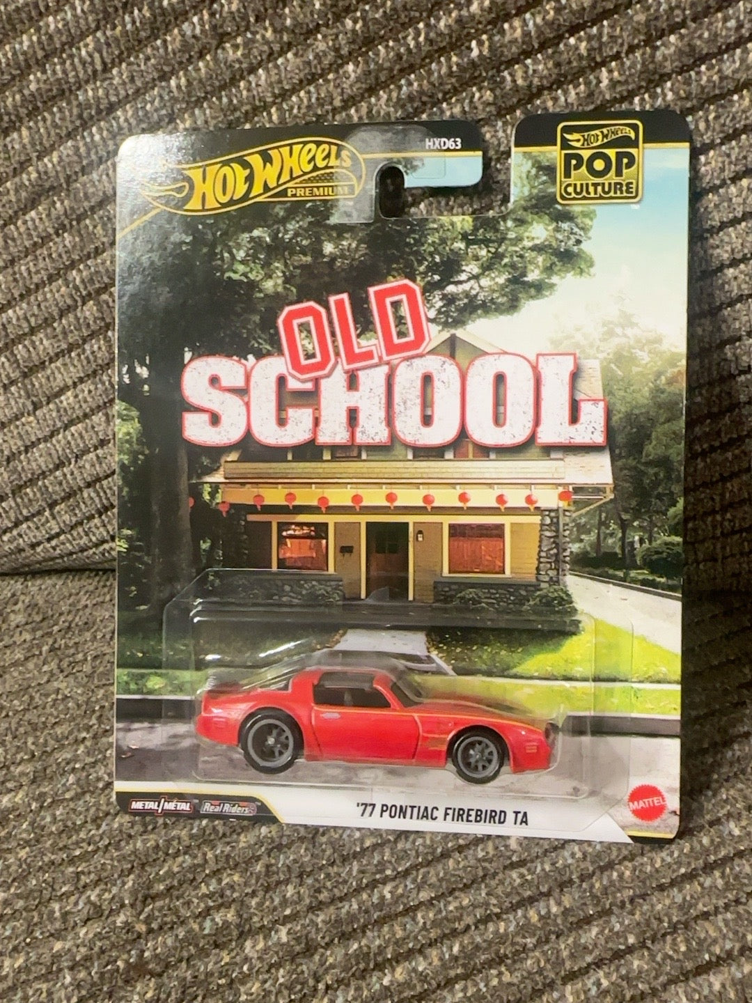 Original photo of red 1977 Pontiac Firebird TA Hot Wheels Premium Old School movie car