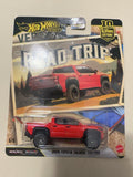 Original photo of red Hot Wheels 2024 Toyota Tacoma TRD Pro Road Trip 5/5 in package