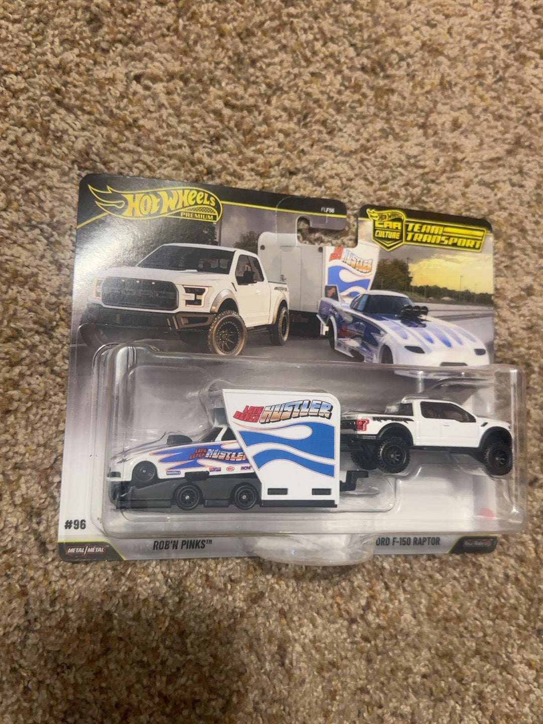 Factory-sealed Hot Wheels Team Transport #96 Rob'n Pinks with Ford F-150 Raptor